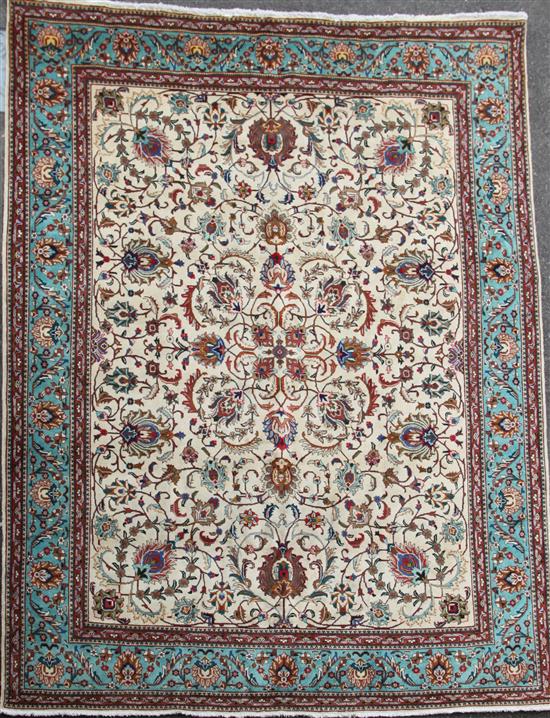A Tabriz Ivory ground carpet, 392cm by 309cm.